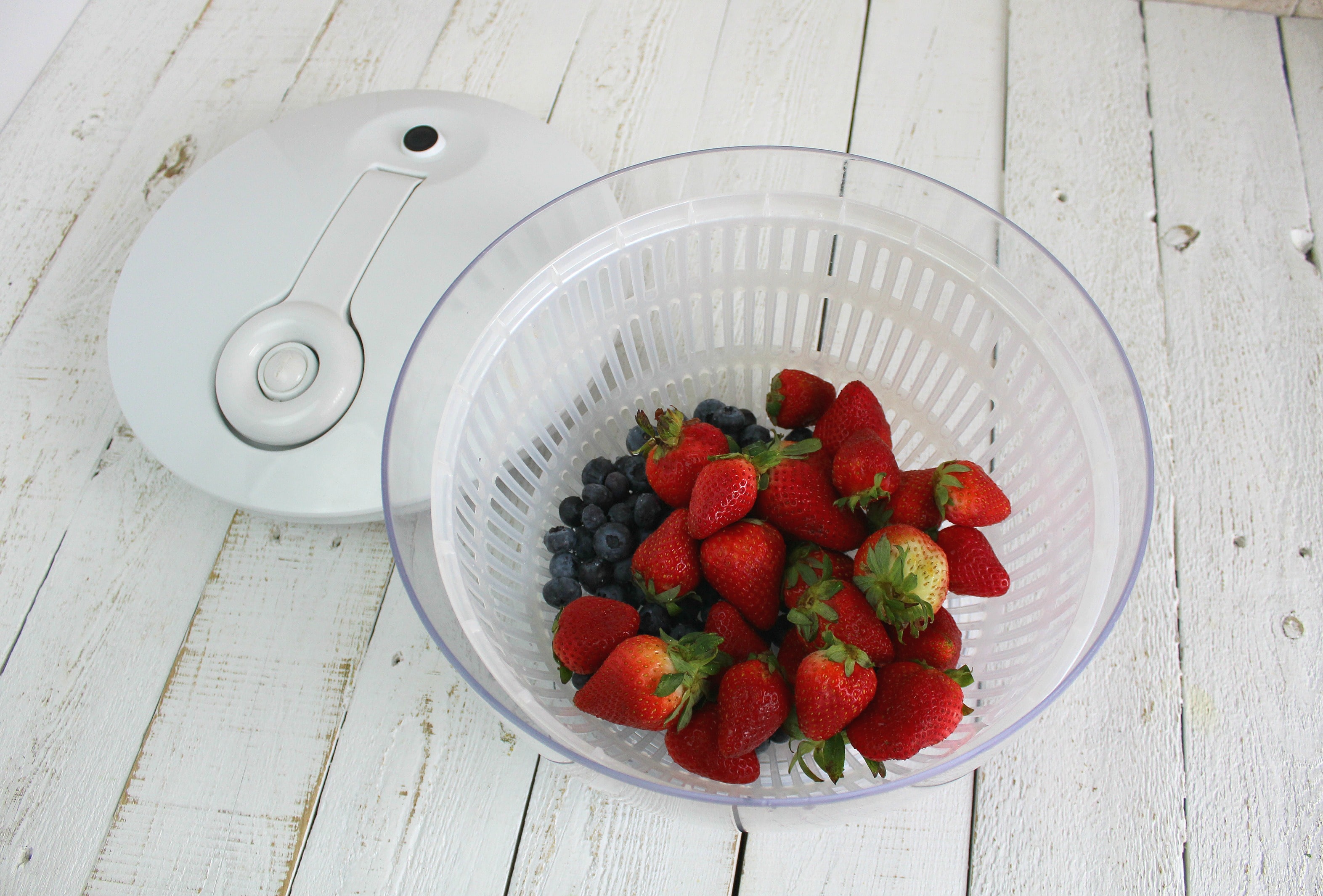 Wash berries in a bowl