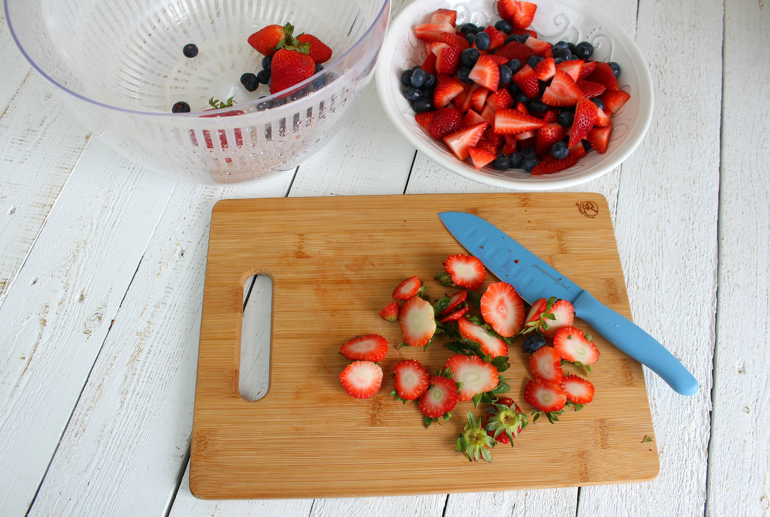 Cup tops off strawberries and chop strawberries into smaller pieces