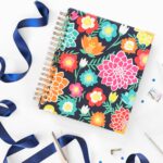 Our fresh new Living Well Planner® is now available for preorder, and we can't WAIT to share it with you! In fact, we are pretty sure our latest edition is going to knock your socks off! Keep reading to find out more about what the next generation of the life-changing Living Well Planner® will include, how you can get your hands on one, and how you can take advantage of our lowest price of the entire year (plus get 2 AWESOME free gifts with your purchase!)