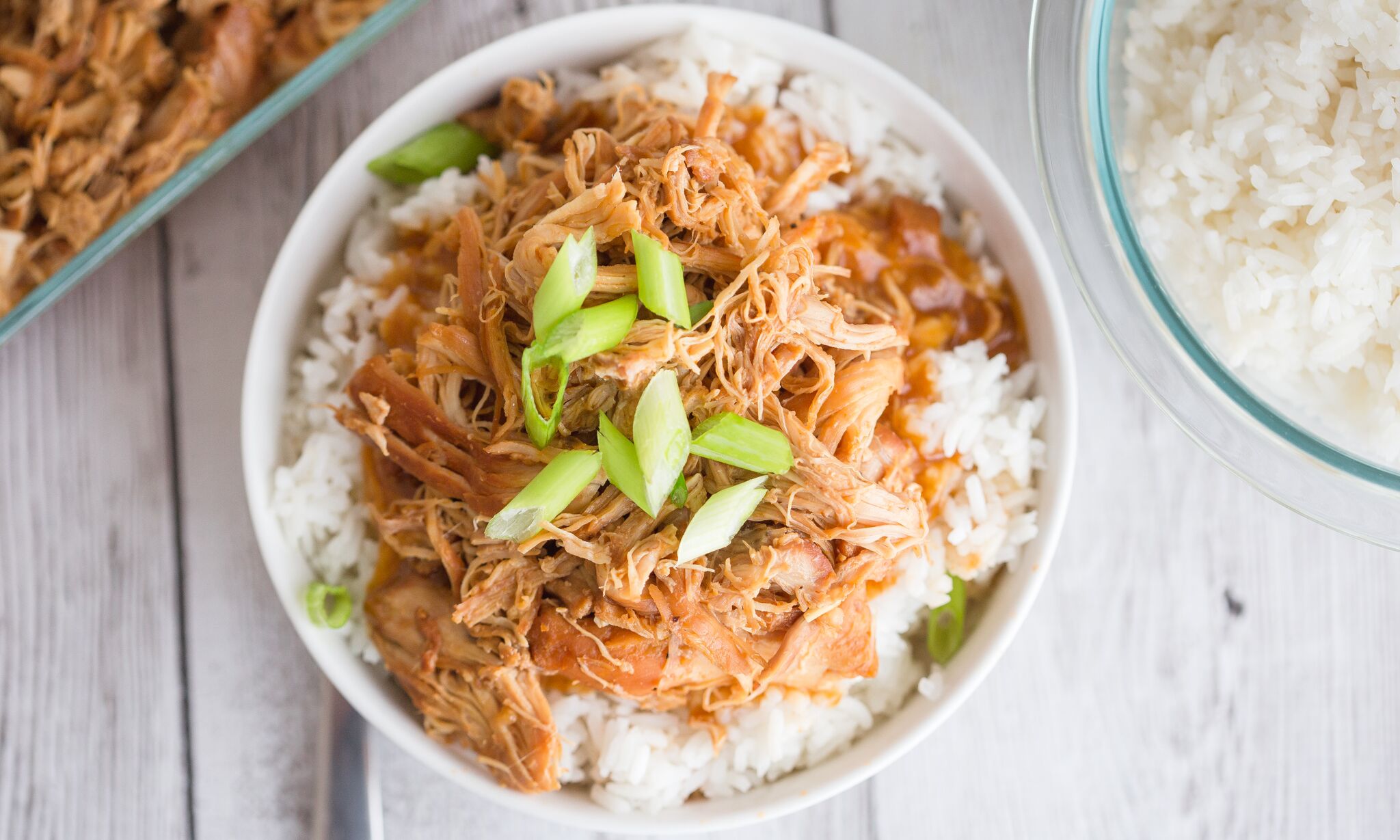 Serve cooked chicken over rice topped with green onions. 