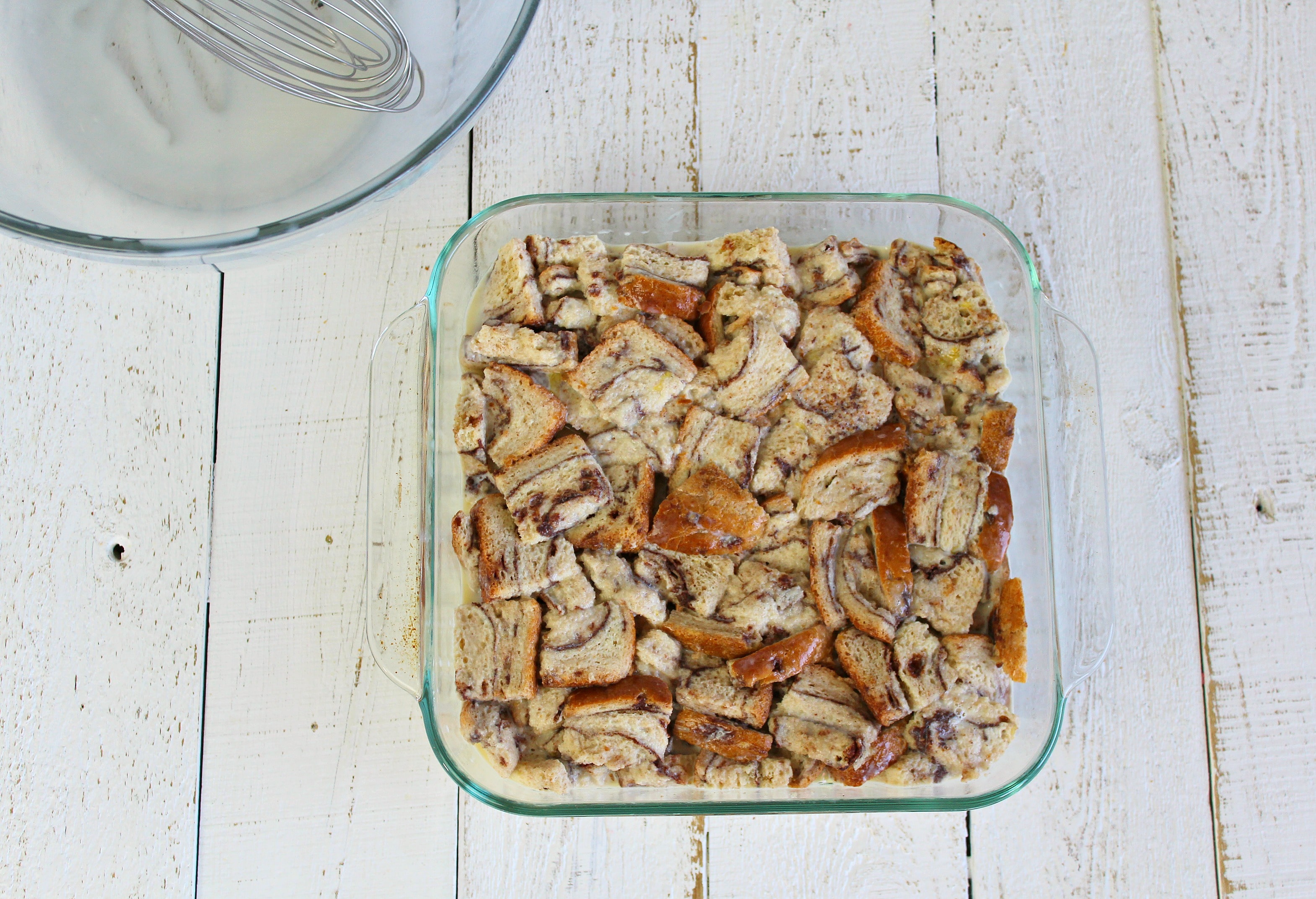 Pour egg and cream mixture over cubed bread for best ever bread pudding recipe