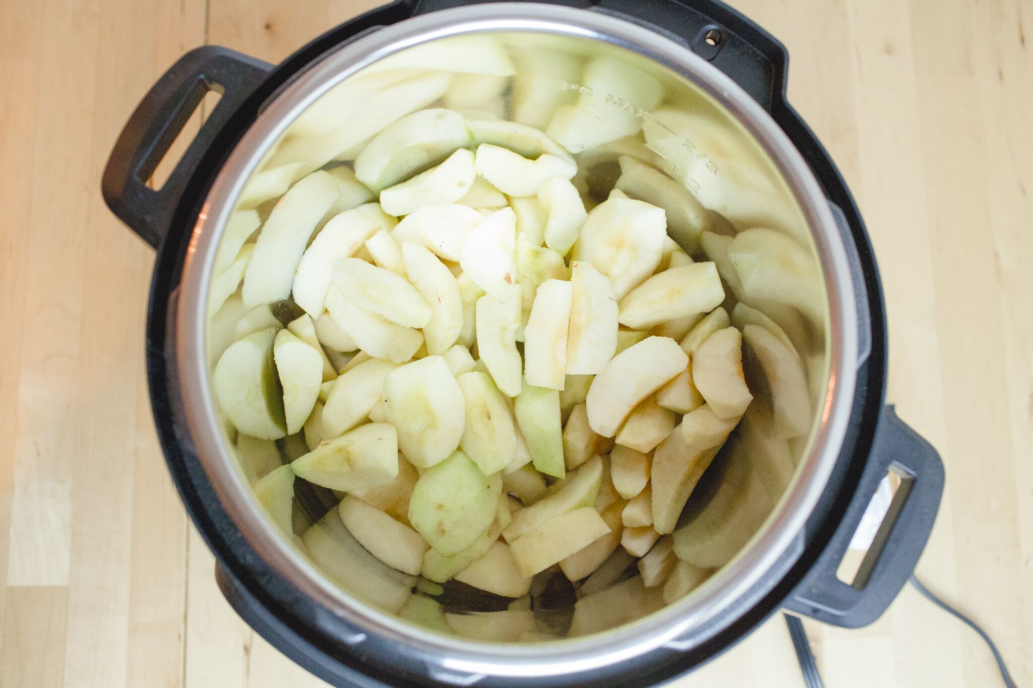 Wash, peel and core apples, then add apples to the Instant Pot.