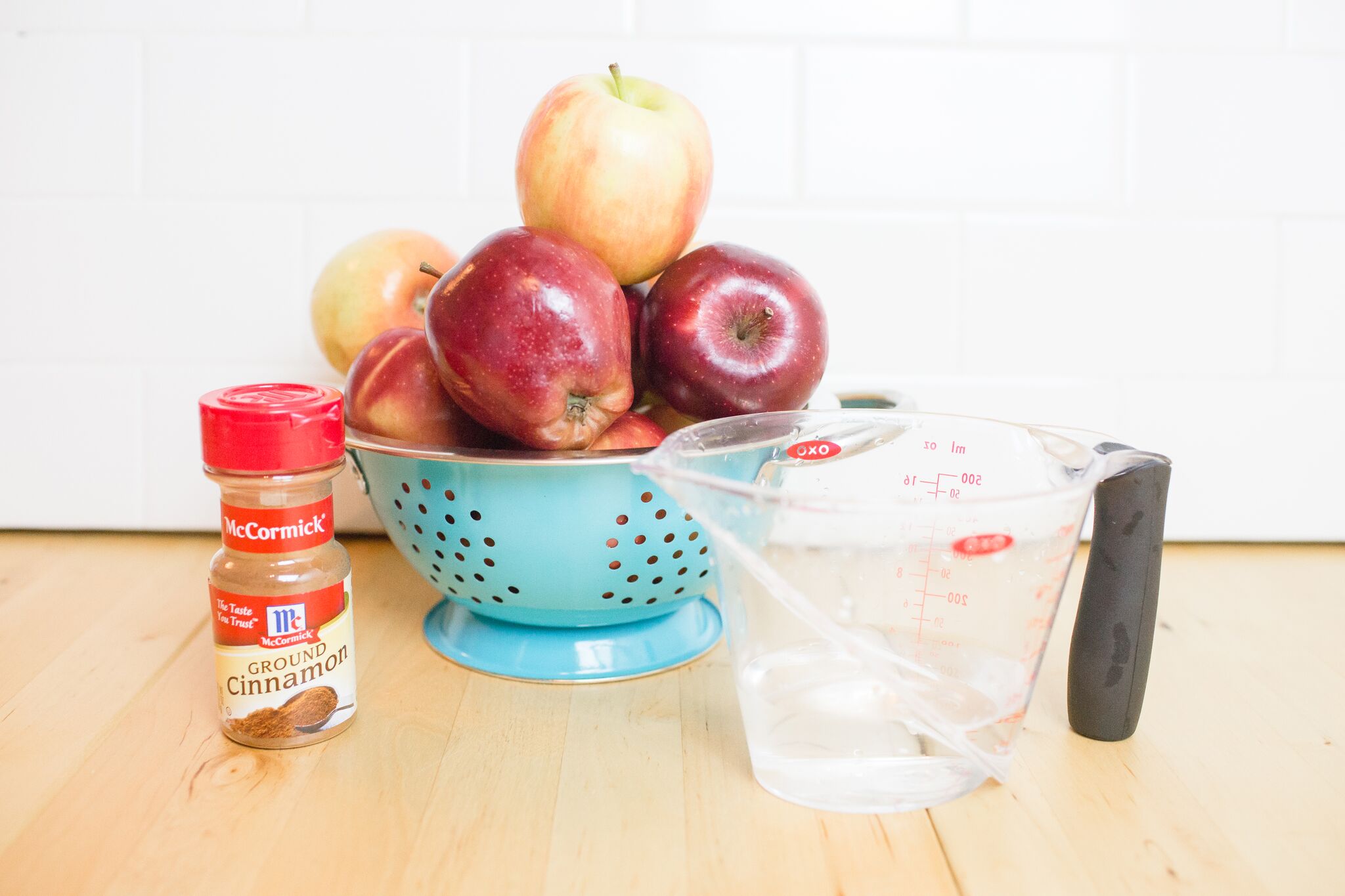 Assemble your ingredients for your Instant Pot applesauce: apples and cinnamon. 