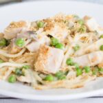 Got turkey leftovers? This Turkey Tetrazzini recipe is one creamy, comforting, and easy to make casserole recipe that will delight your whole family!