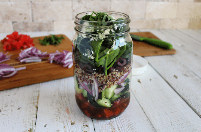 Looking for healthier lunch options that you can make ahead of time? These Mason Jar Salads are easy to assemble and will last you all week! 