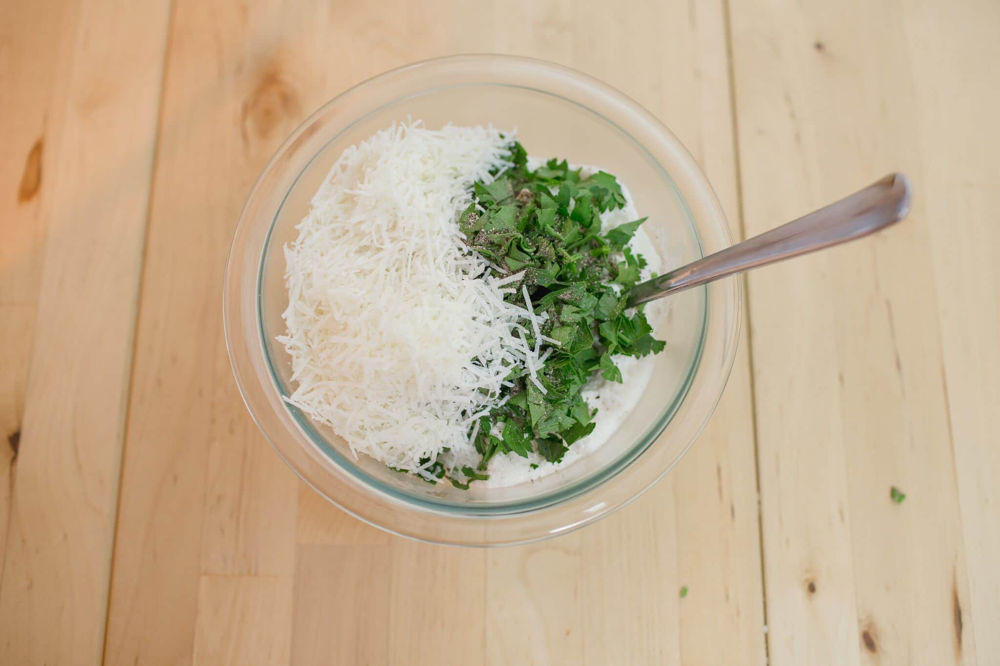 Mix together 3 cheeses and parsley and pepper-Looking for a hearty meal that the whole family will love? This Lasagna Soup recipe tastes great, uses simple, easy-to-find ingredients, and can be made in an hour or less! Did we mention it's a perfect recipe for the Instant Pot too? 