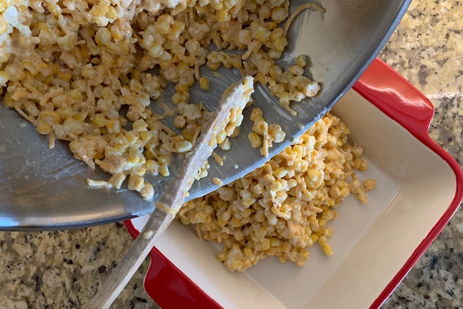 Pour ingredients into casserole dish.It's hard to find a side dish that even the pickiest eaters will embrace, but this Creamy Corn Casserole with crushed Ritz Cracker topping definitely does the trick. It's easy, delicious and always a hit--your new holiday go-to recipe! #recipes #cornrecipes #casserolerecipes #kidfriendlyrecipes #easyrecipes #holidayrecipes