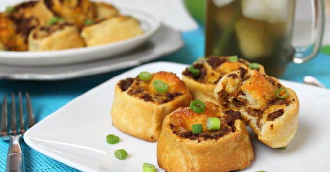 Sloppy joe pinwheels-Throwing a party? These 12 make ahead appetizers can be made in advance or thrown in the crockpot on the day of your party and are sure to wow your guests! 