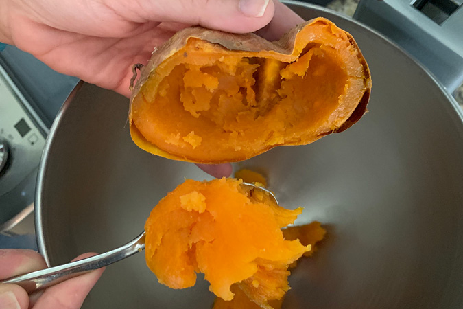 Step 2 scoop out sweet potatoe flesh-A word of warning--once you've tried these incredible Twice Baked Sweet Potatoes, no other sweet potatoes will ever quite compare! They're not only utterly delicious (not to mention semi-addicting) and also a complete show-stopper for your Thanksgiving dinner. #recipes #thanksgivingrecipes #holidayrecipes #easyrecipes