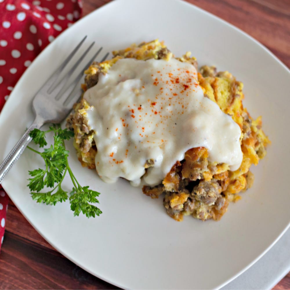 This overnight croissant breakfast casserole with sawmill gravy can be made the night before so all you have to do the next morning is pop it into the oven! Perfect for the holidays (or anytime)!