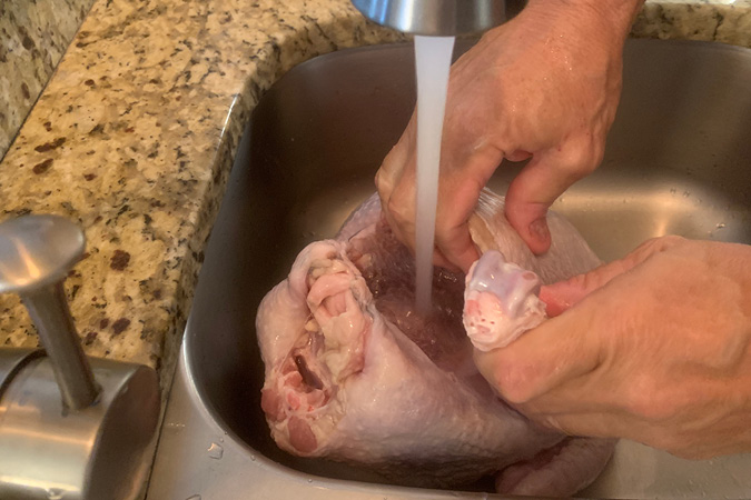 Continue to rinse turkey if still somewhat frozen.