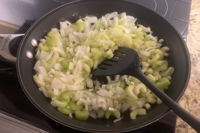 Cook veggies for stuffing.