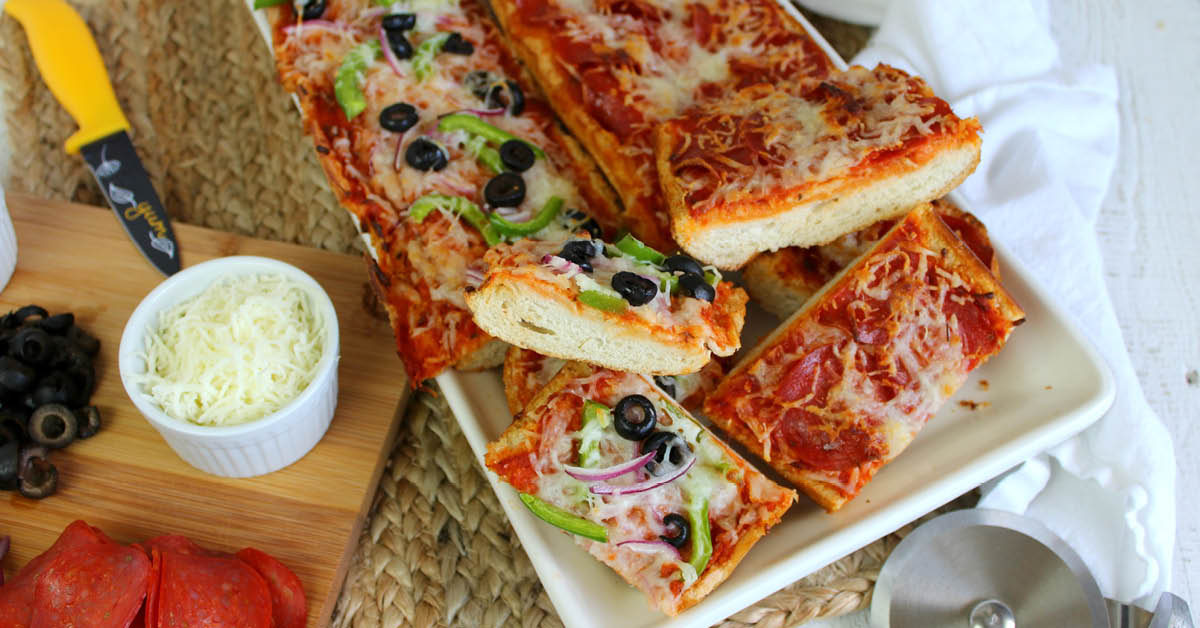 Low on flour? Craving pizza? With this easy and delicious garlic bread pizza recipe, you don't need it! Get the family involved in creating their custom pizzas without all the work and have it on the table in minutes. It's sure to become a family favorite!